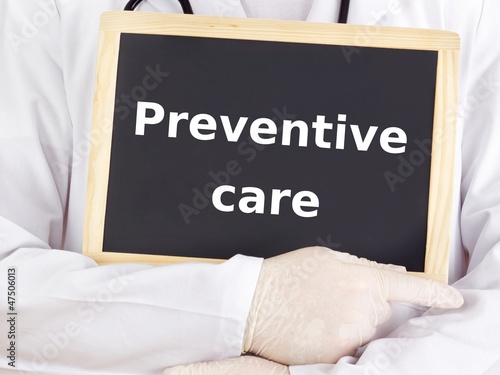 фотографія Doctor shows information on blackboard: preventive care