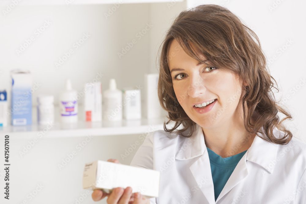 Young woman pharmacist with a bottle of drugs Young woman pharmacist with a bottle of drugs