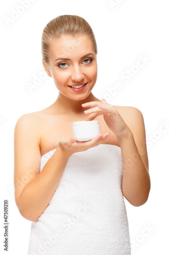 Beautiful blond woman tender jar of moisturizer cream