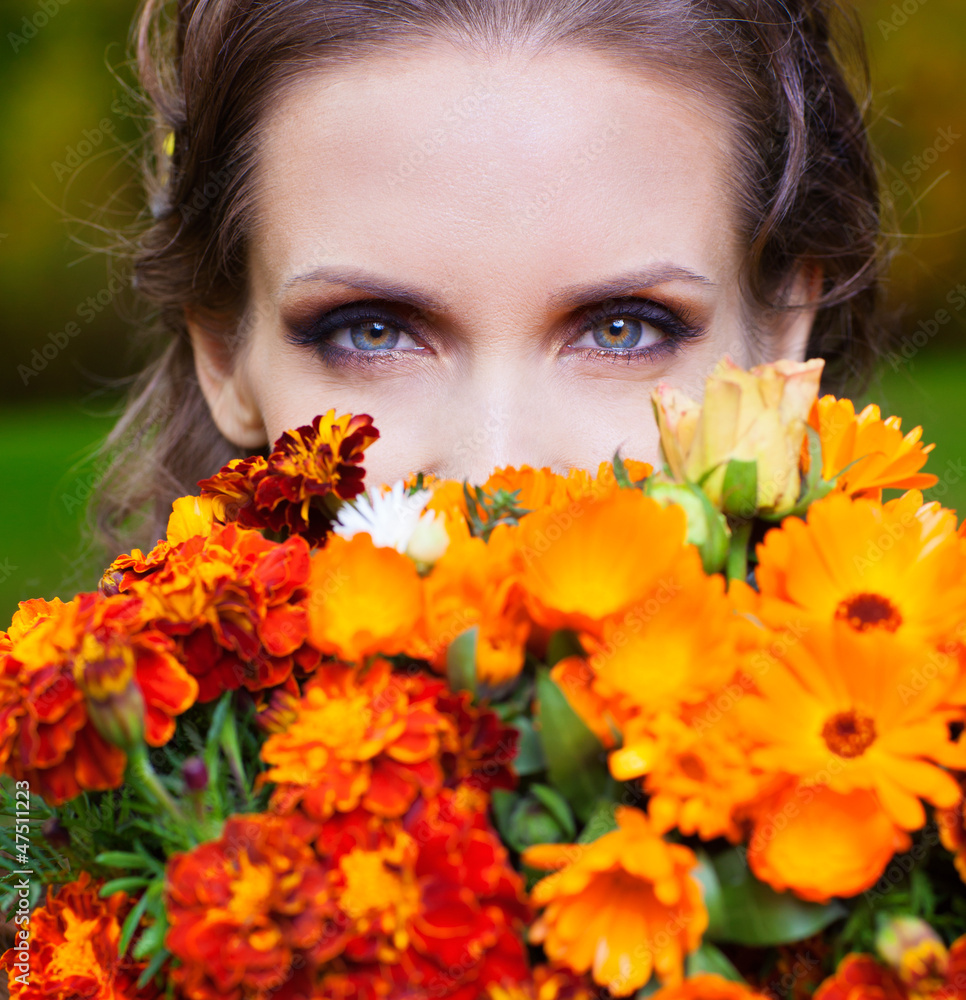A beautiful brunette with flowers A beautiful brunette with flowers