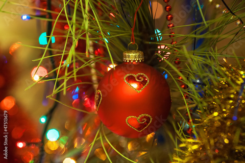 Beautiful Christmas ball on the tree - Defocused photo