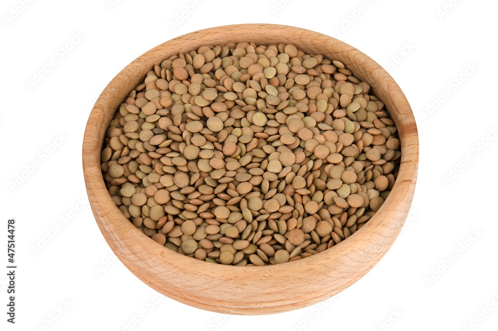 Raw lentils in wooden bowl isolated on white (clipping path) Raw lentils in wooden bowl isolated on white (clipping path)