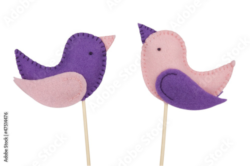 Handmade felt birds on sticks isolated on white (clipping path)