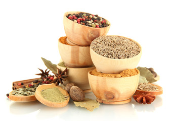 Fototapete Gewürze wooden bowls and spoons with spices isolated on white  © Africa Studio