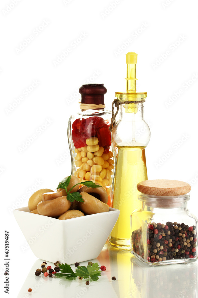 Delicious marinated mushrooms in bowl with spices isolated Delicious marinated mushrooms in bowl with spices isolated