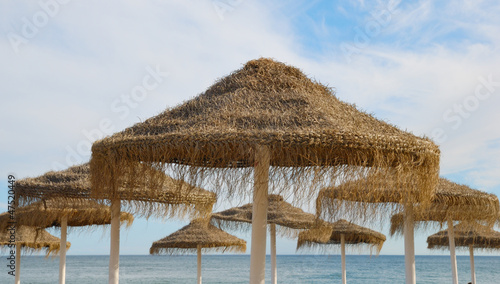 Straw umbrellas on Marbella beach