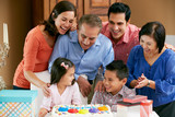 Multi Generation Family Celebrating Children's Birthday