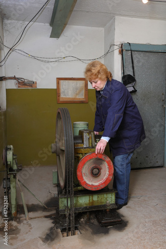 Engineer woman in machine room (elevator).