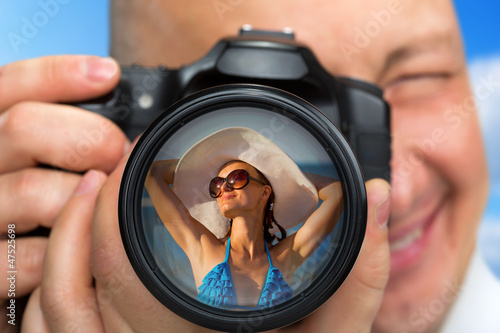 Photographer capturing portrait of bikini girl
