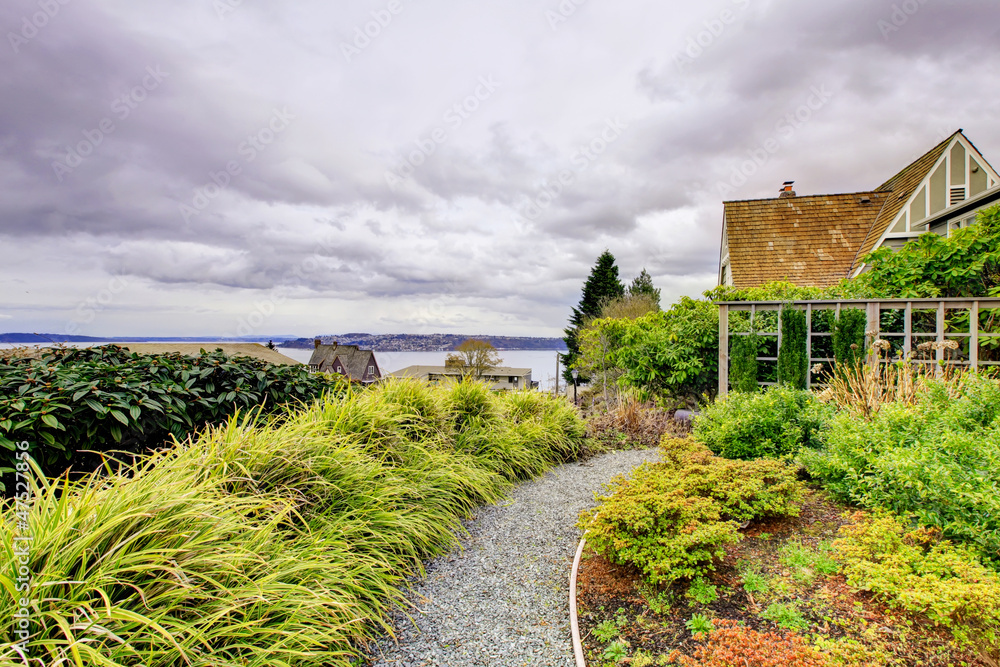 Dark and cloudy Tacoma winter with frot yard landscape. Dark and cloudy Tacoma winter with frot yard landscape.