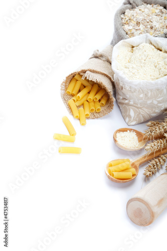 Flour in a canvas bag and ear on white background.
