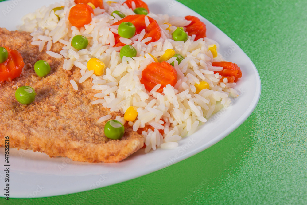 Close-up chicken fillet with side dish of rice and vegetable Close-up chicken fillet with side dish of rice and vegetable