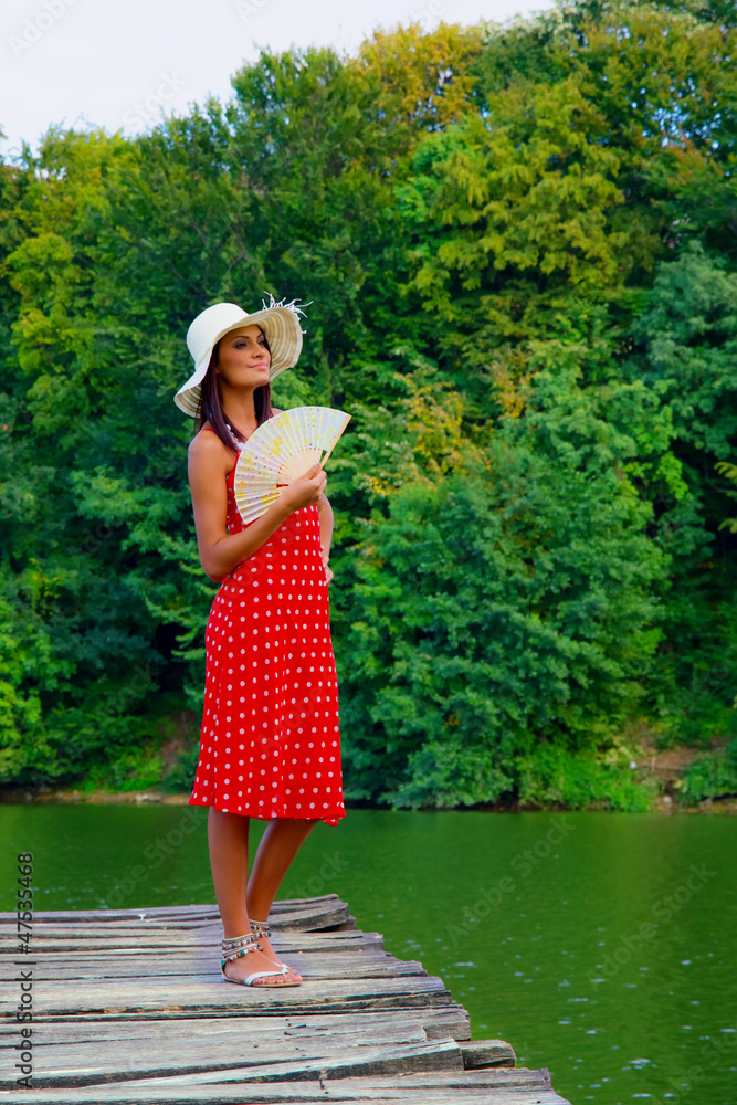 Fototapeta premium Young woman posing, outside shot in summer day