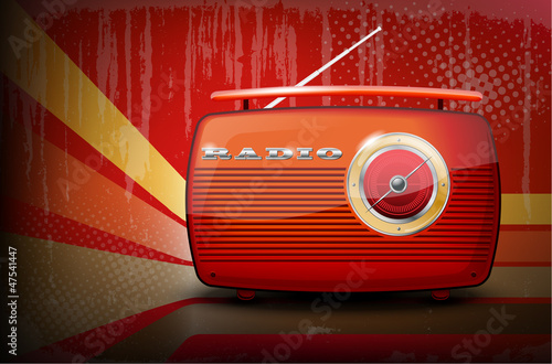 Red vintage radio on retro stripe background with vignetting