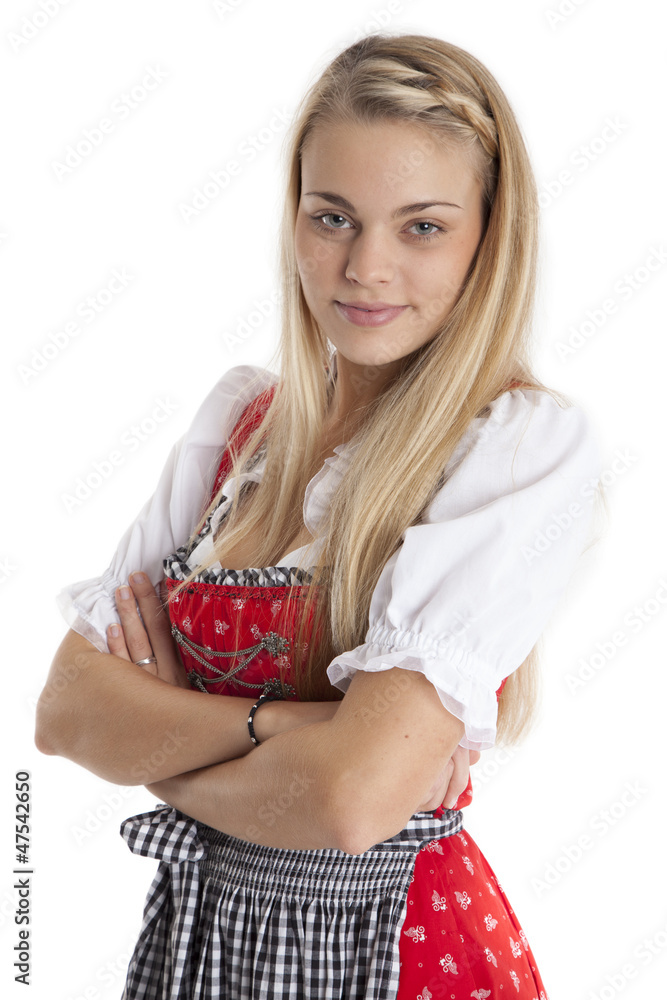 Frau im Dirndl verschränkt die Arme Frau im Dirndl verschränkt die Arme