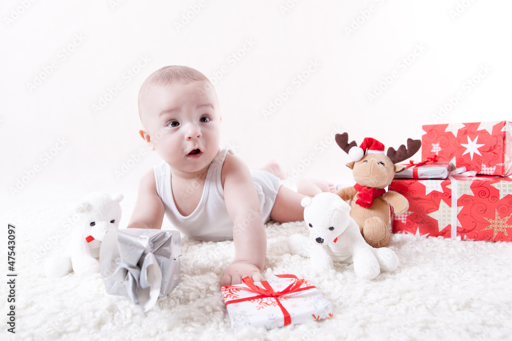 Surprised baby with presents and toys Surprised baby with presents and toys