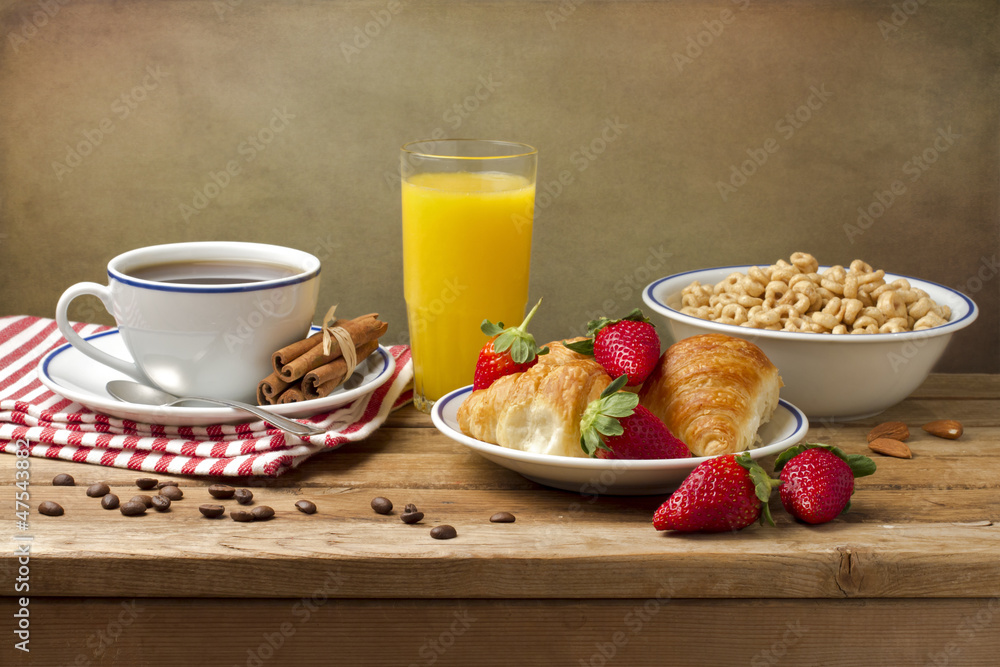Breakfast setting on wooden table Breakfast setting on wooden table
