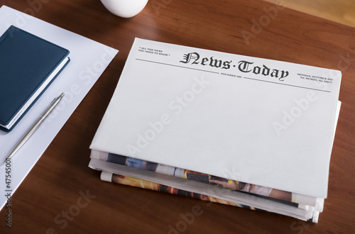 Blank newspapers on the office desktop