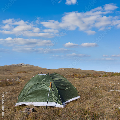 green touristic tent in a steppe