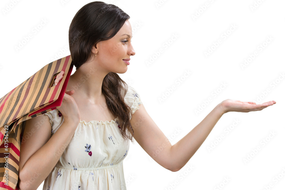 Portrait of charming young woman presenting your product over wh Portrait of charming young woman presenting your product over wh
