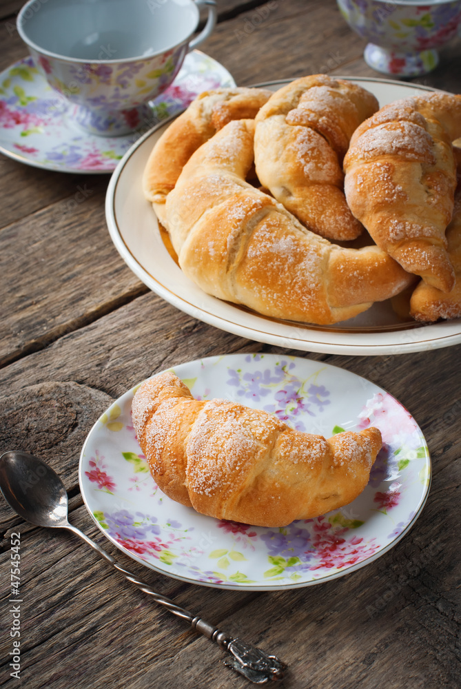 Croissants with Sugar on Wooden Table Croissants with Sugar on Wooden Table