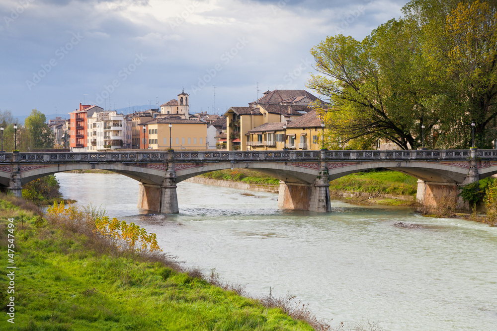 view of bridge through Parma stream, Italy