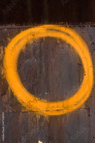 Orange Hand painted circle on a wall
