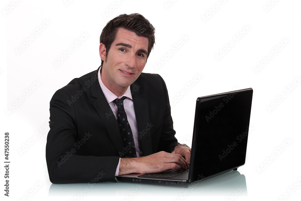 Man with computer in the office Man with computer in the office