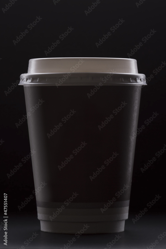 Paper coffee cup on a black background Paper coffee cup on a black background