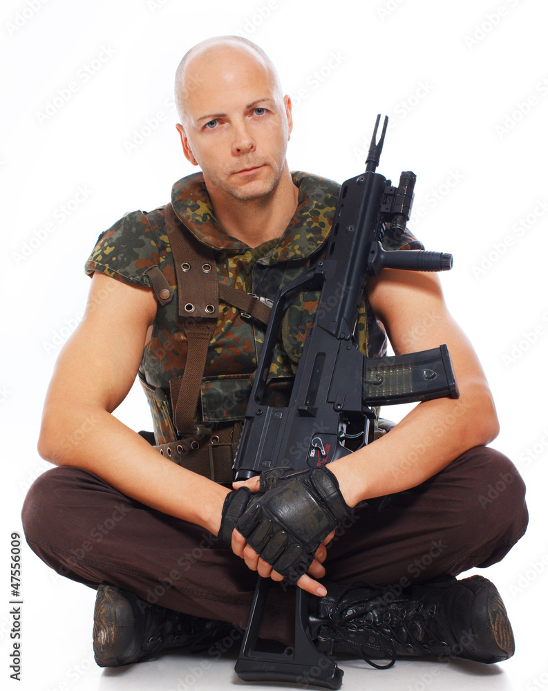 Fototapeta premium Portrait of soldier posing on white background