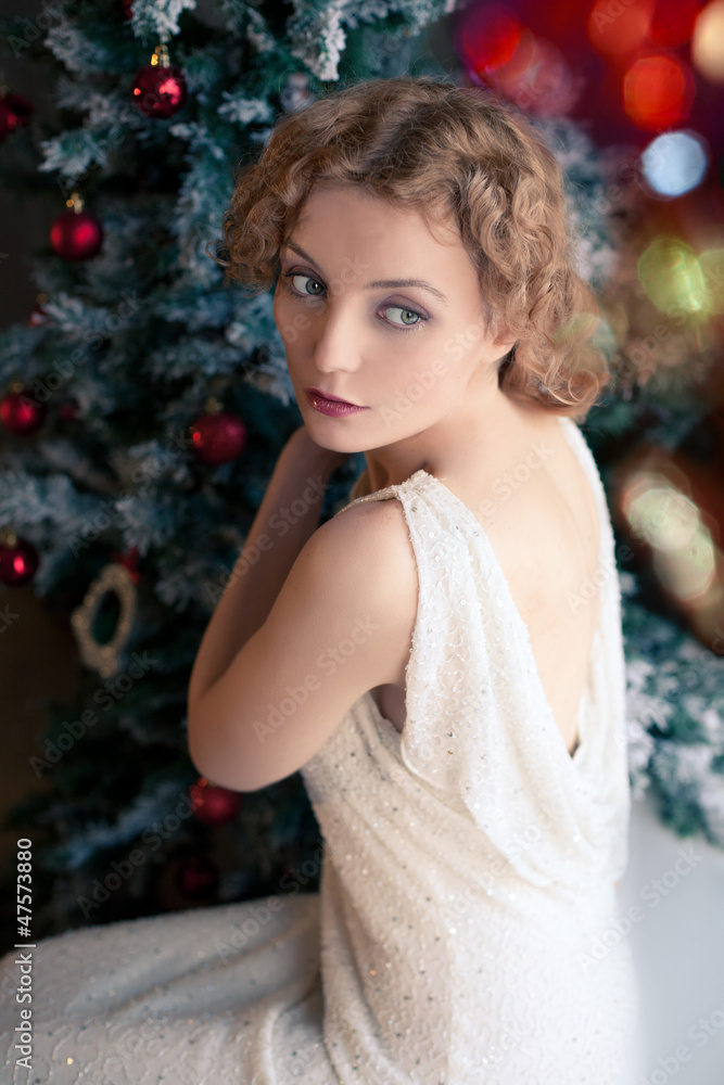 blonde woman near Chriatmas tree in retro style blurred blonde woman near Chriatmas tree in retro style blurred