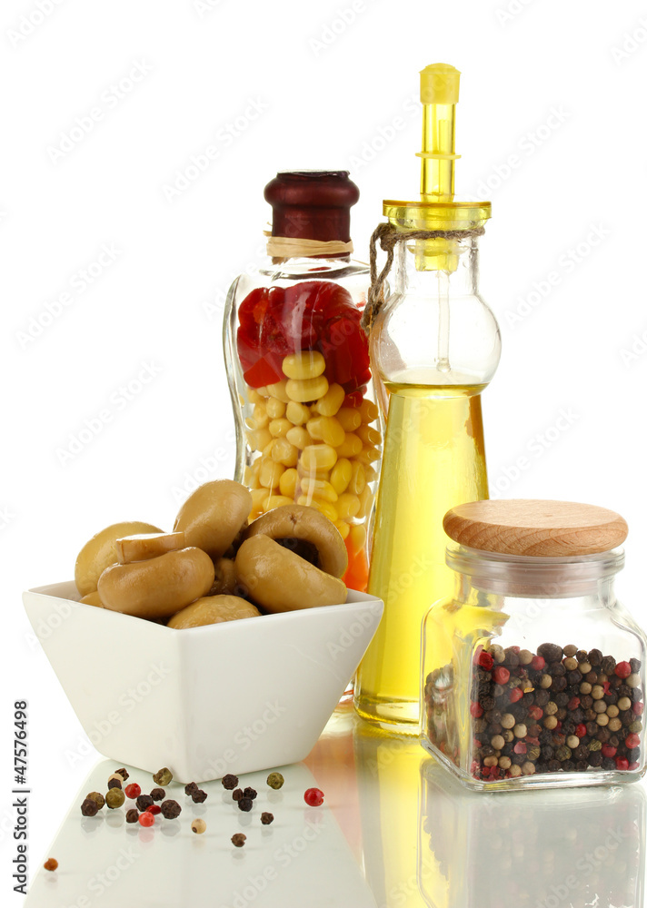 Delicious marinated mushrooms in bowl with spices isolated Delicious marinated mushrooms in bowl with spices isolated