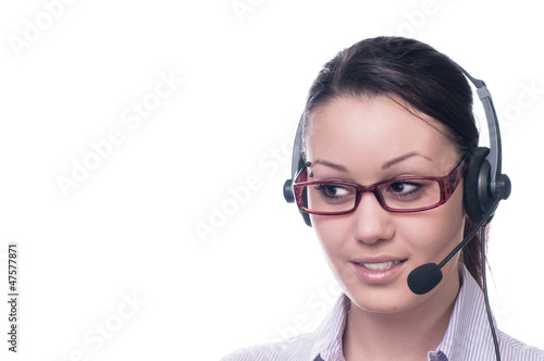 Cute business woman with headset at workplace