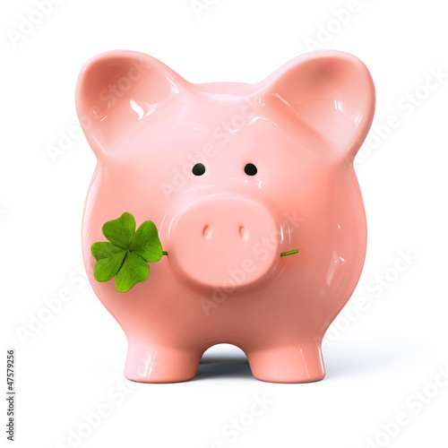 Piggy bank with four leaf clover photo