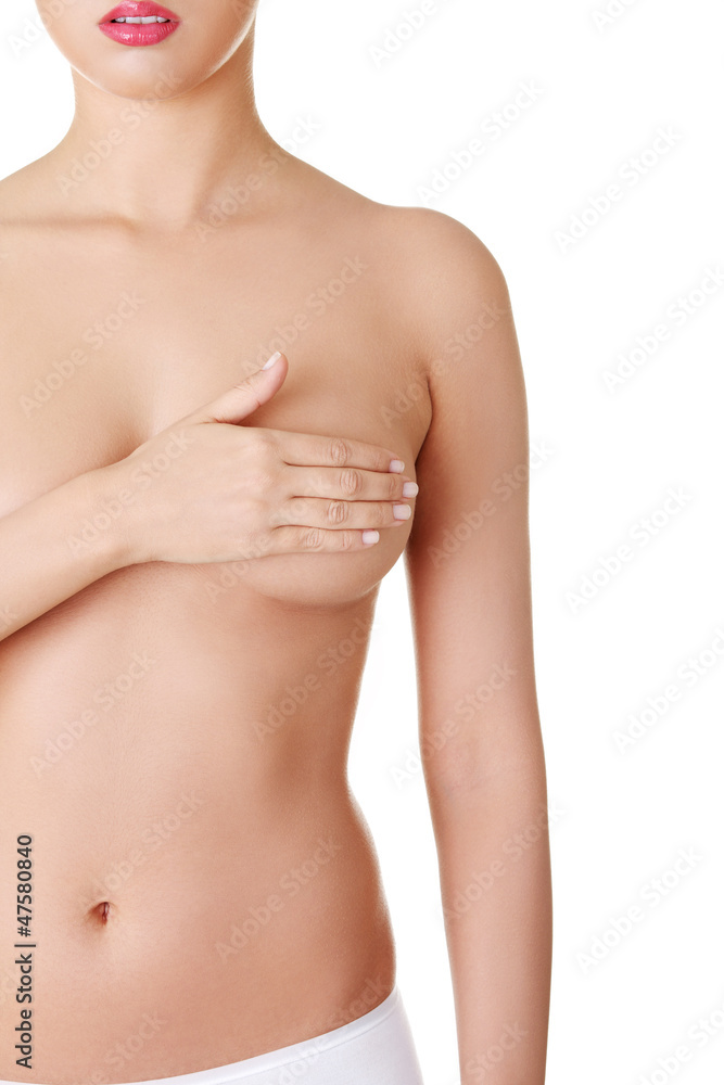 Fototapeta premium Kobieta trzyma ją za pierś