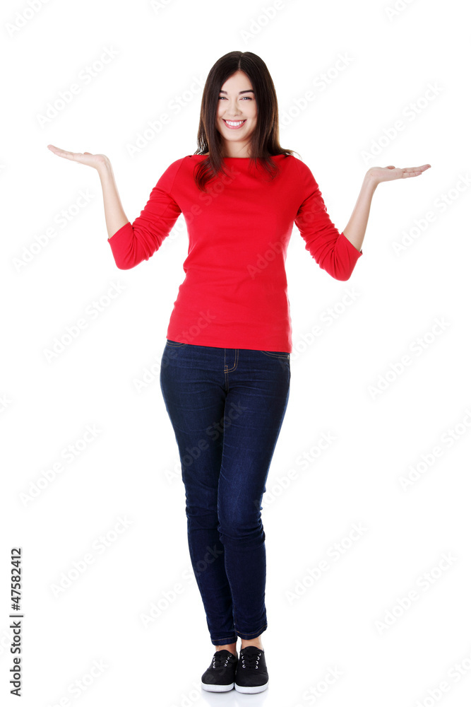 Happy woman showing something on the palm Happy woman showing something on the palm