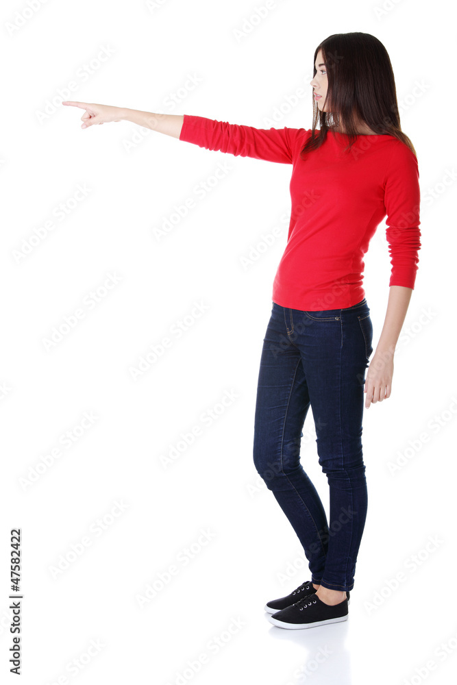 Happy woman pointing on copy space Happy woman pointing on copy space