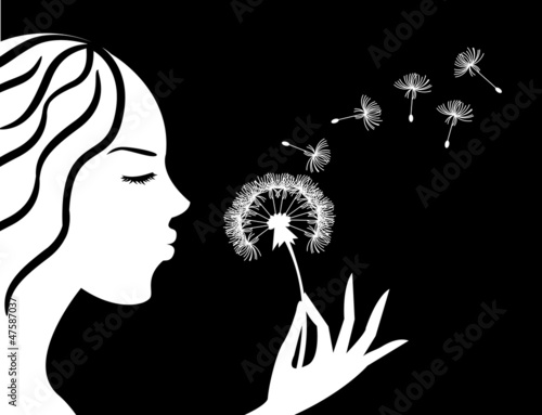 girl blowing a dandelion