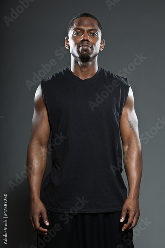 Tough and cool black american basketball player. Studio shot.