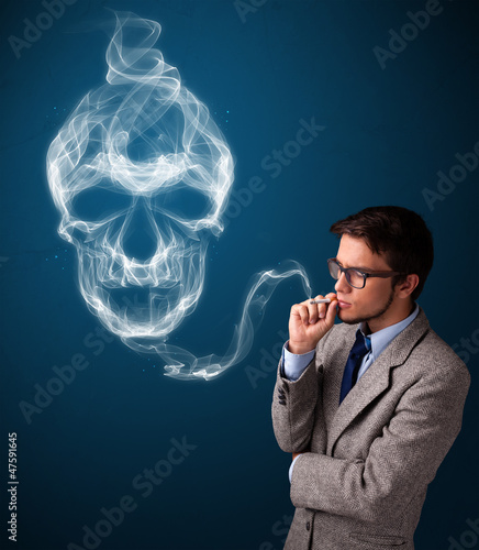 Young man smoking dangerous cigarette with toxic skull smoke