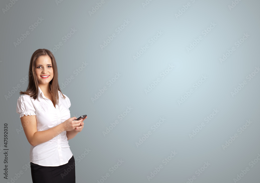 attractive woman holding a phone with copy space attractive woman holding a phone with copy space