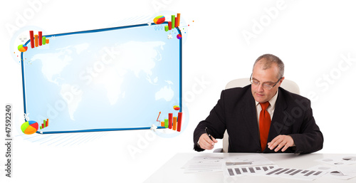 Businessman sitting at desk with copy space photo