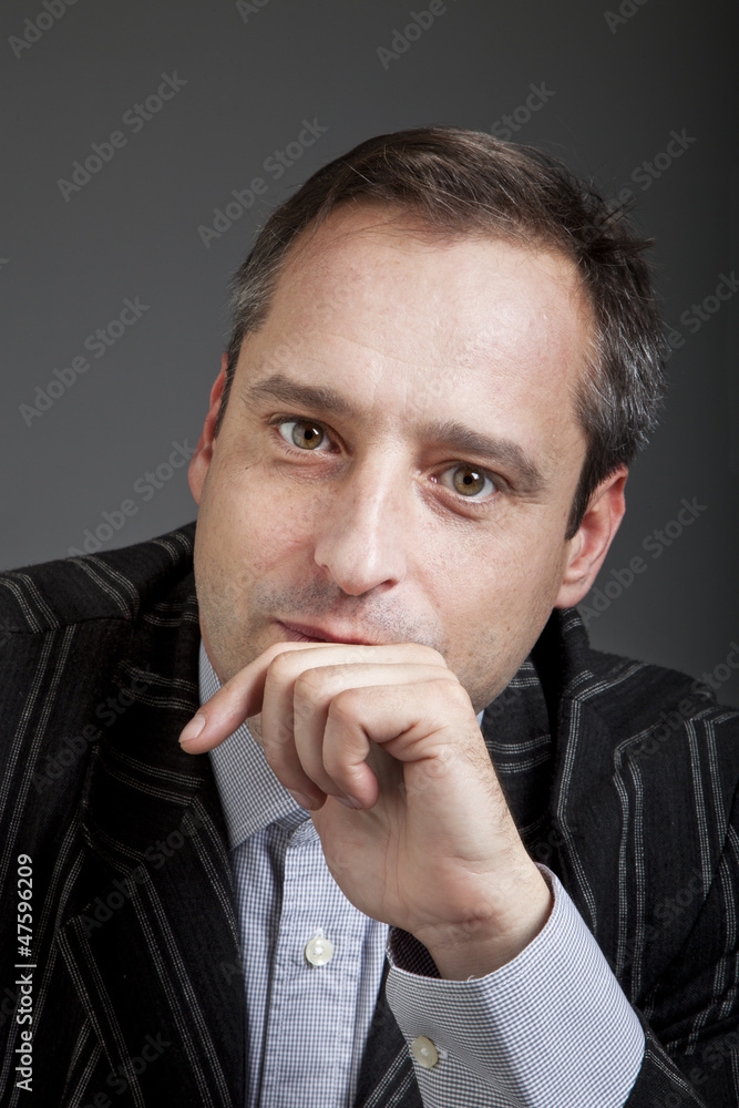 portrait of adult man isolated on dark background portrait of adult man isolated on dark background
