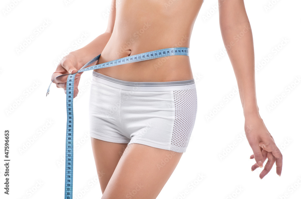 Woman measuring waist of perfect body