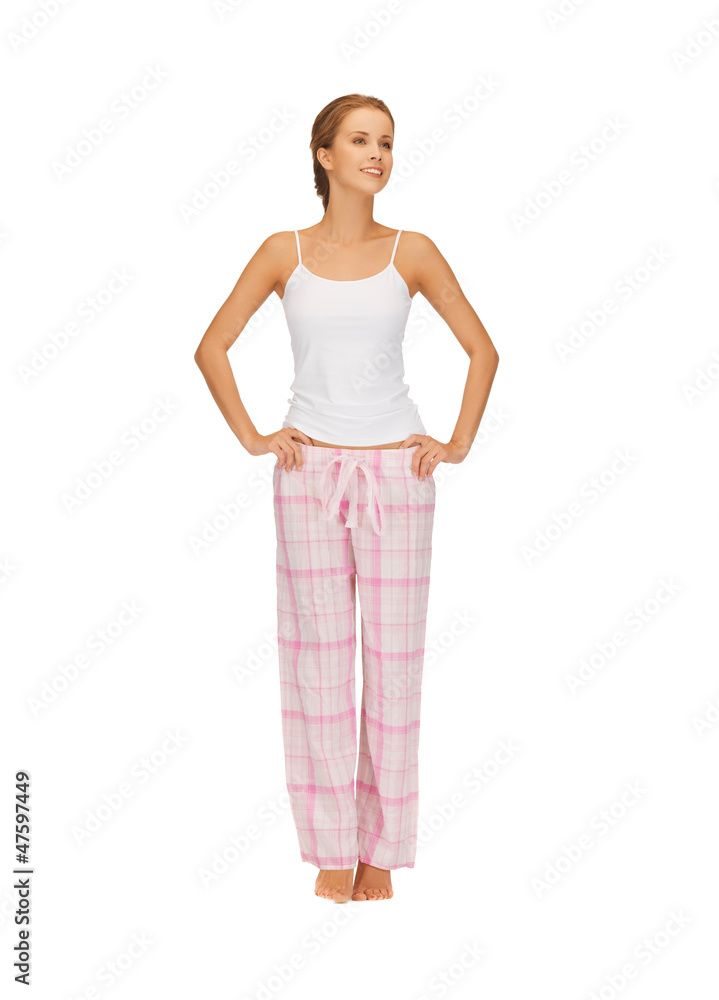 happy and smiling woman in cotton pajamas happy and smiling woman in cotton pajamas
