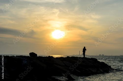 Sunset with lonely woman