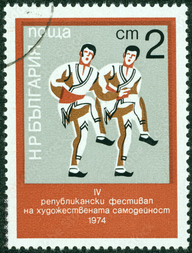 stamp printed in Bulgaria shows Folk-dancers
