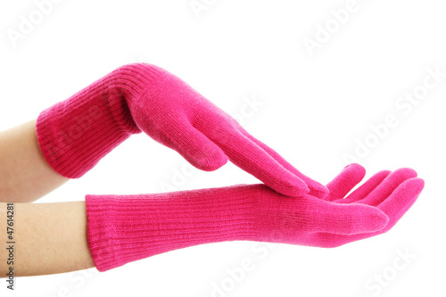 woman knitted gloves on hands, isolated on white photo