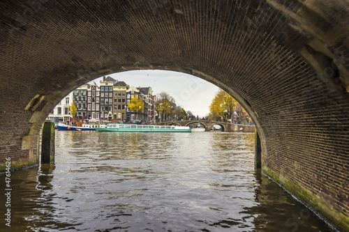View from under bridge to Amsterdam  in the late autumn  Amstel
