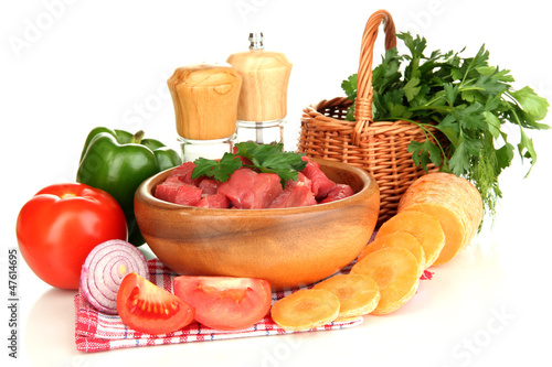 Fototapeta Naklejka Na Ścianę i Meble -  Raw beef meat in bowl with herbs and spices isolated on white